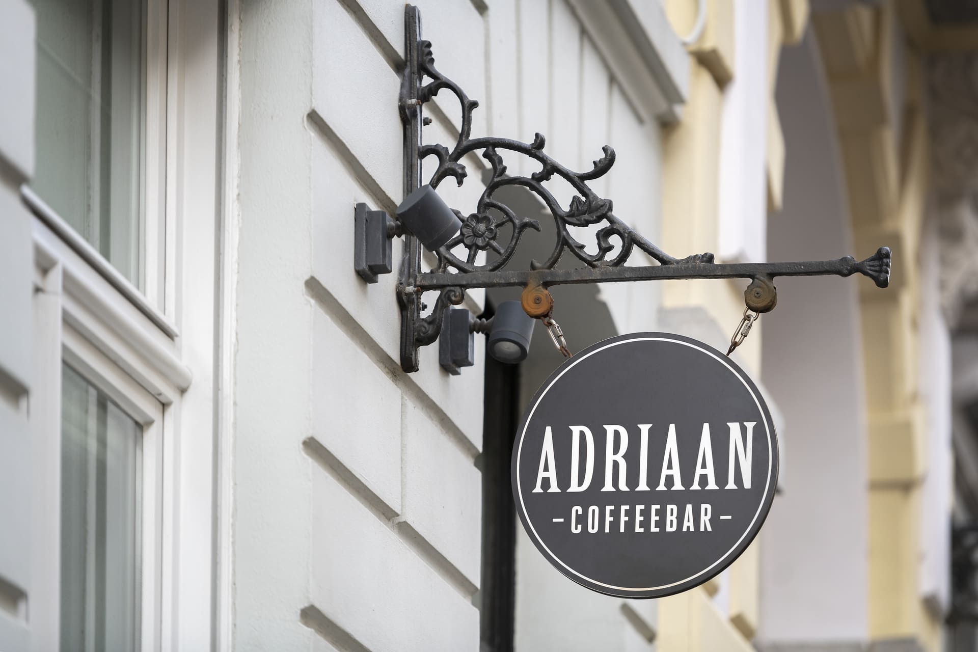 Coffeebar Adriaan Logo Signage on Historic Bruges Building